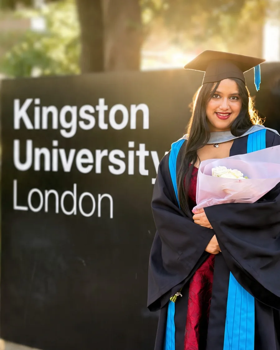 Vibha in her graduation gown at Kingston University London.
