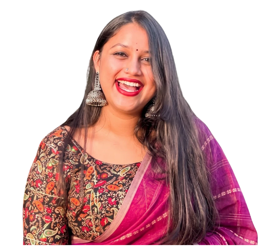 Vibha Bharadwaj, laughing, in a magenta sari and silver earrings.