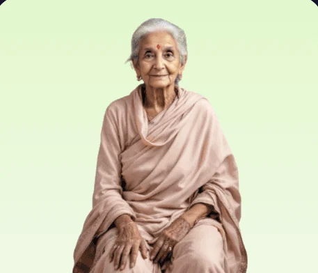 An elderly woman in a pale pink sari.